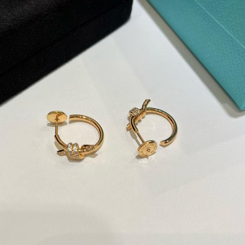 yellow gold knot style hoop earrings with crystal pave