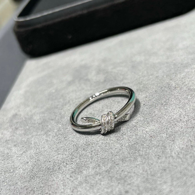 white gold knot style diamond pave ring