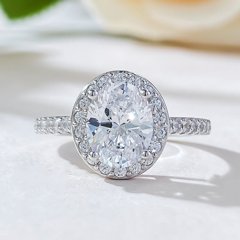 Anillo de diamantes de alto carbono con diseño de huevo de paloma ovalado de plata CrownJewel de 7 x 9 pulgadas