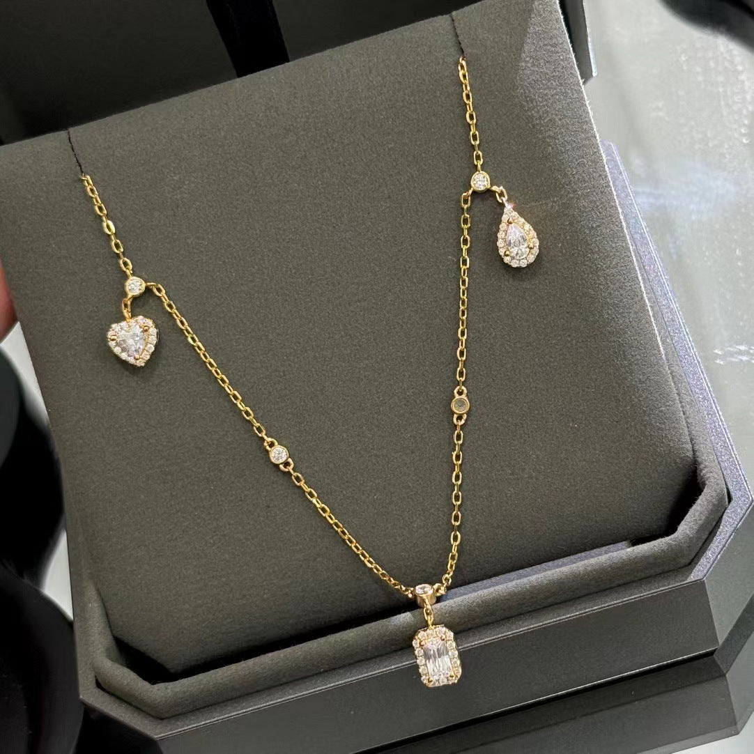 Drop-shaped diamond inlaid pendant with fashionable tassel design