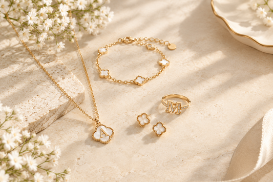 Monogram-inspired jewelry featuring personalized letter and floral motifs