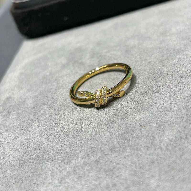 yellow gold knot style diamond pave ring
