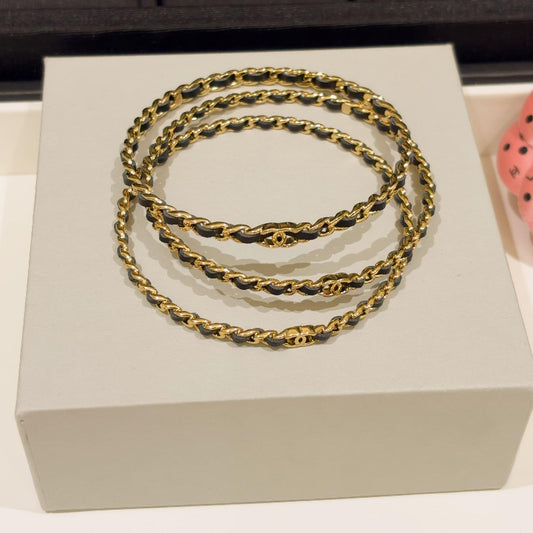 26P style CC black leather woven chain 3-in-1 bangle set on white background