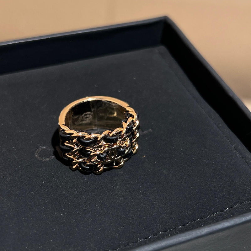 26P style CC black leather woven triple-row ring on white background