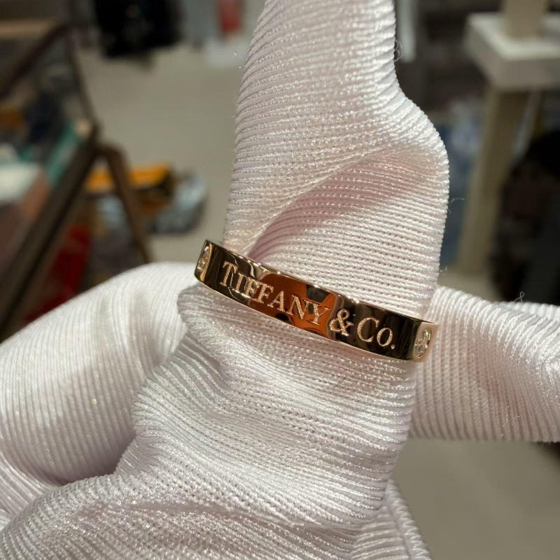 close up of channel set crystal pave on 3mm rose gold band ring