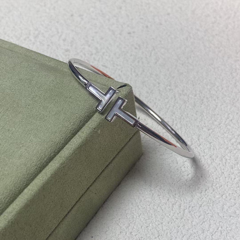 white gold T style mother of pearl wire bracelet