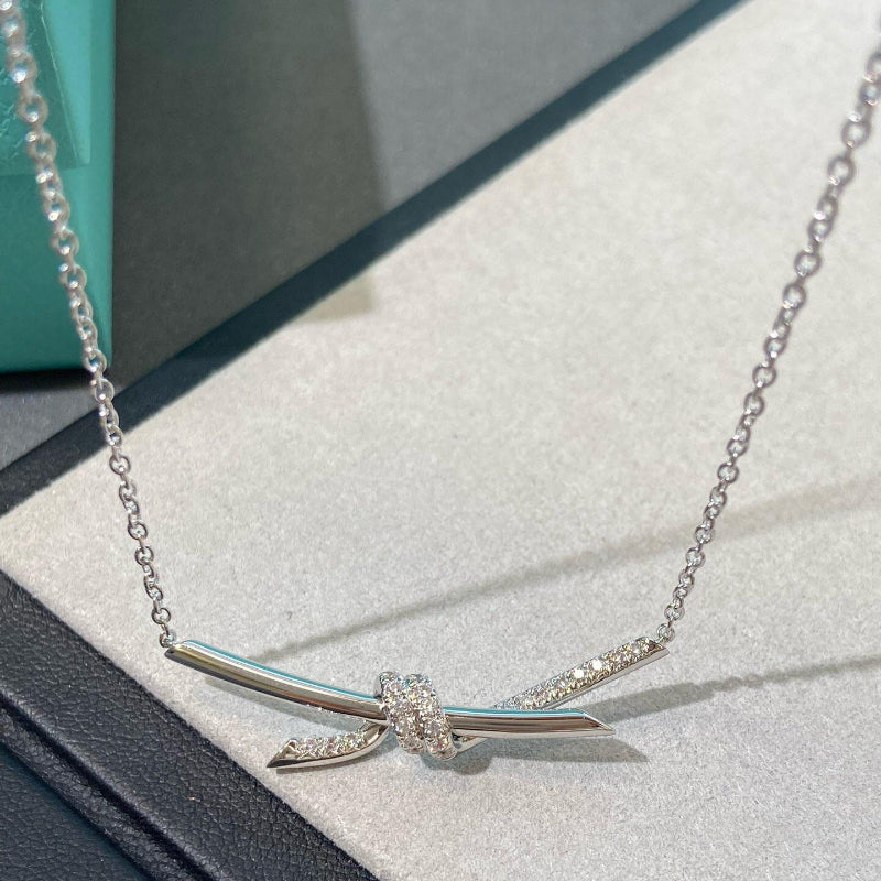 white gold knot style diamond pendant
