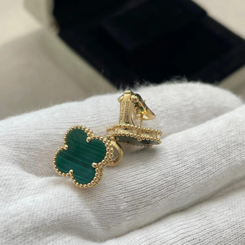 close up of green banded malachite four leaf clover motif with gold bead contour on yellow gold earrings
