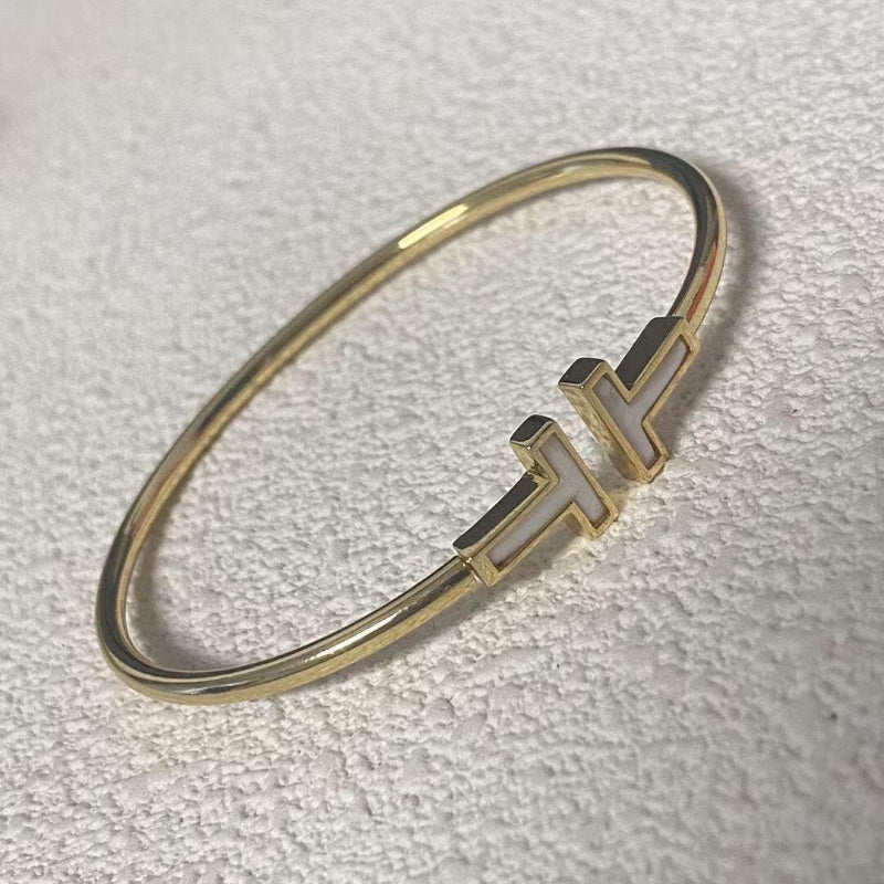 yellow gold T style mother of pearl wire bracelet