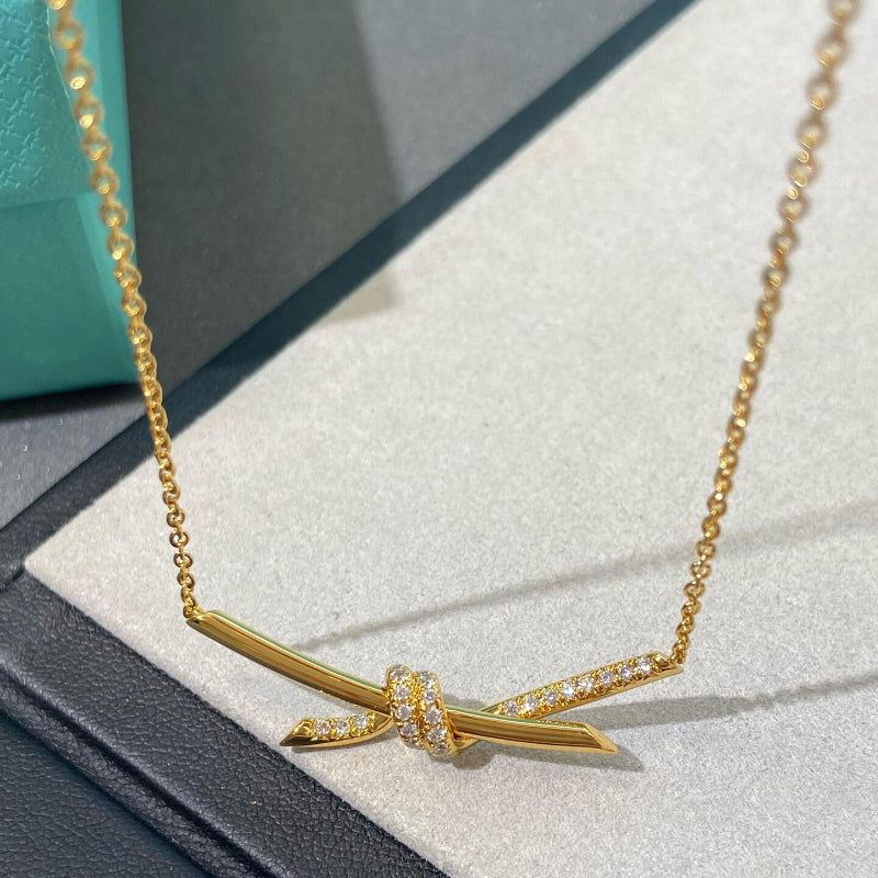 yellow gold knot style diamond pendant