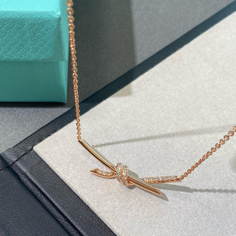rose gold knot style diamond pendant