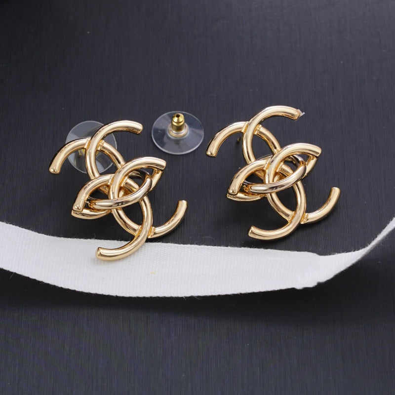 close up of interlocking CC logo stud earrings gold tone small size