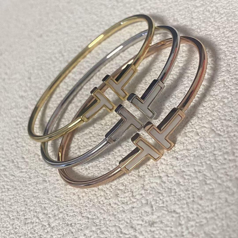 T style mother of pearl wire bracelet 18K gold plated