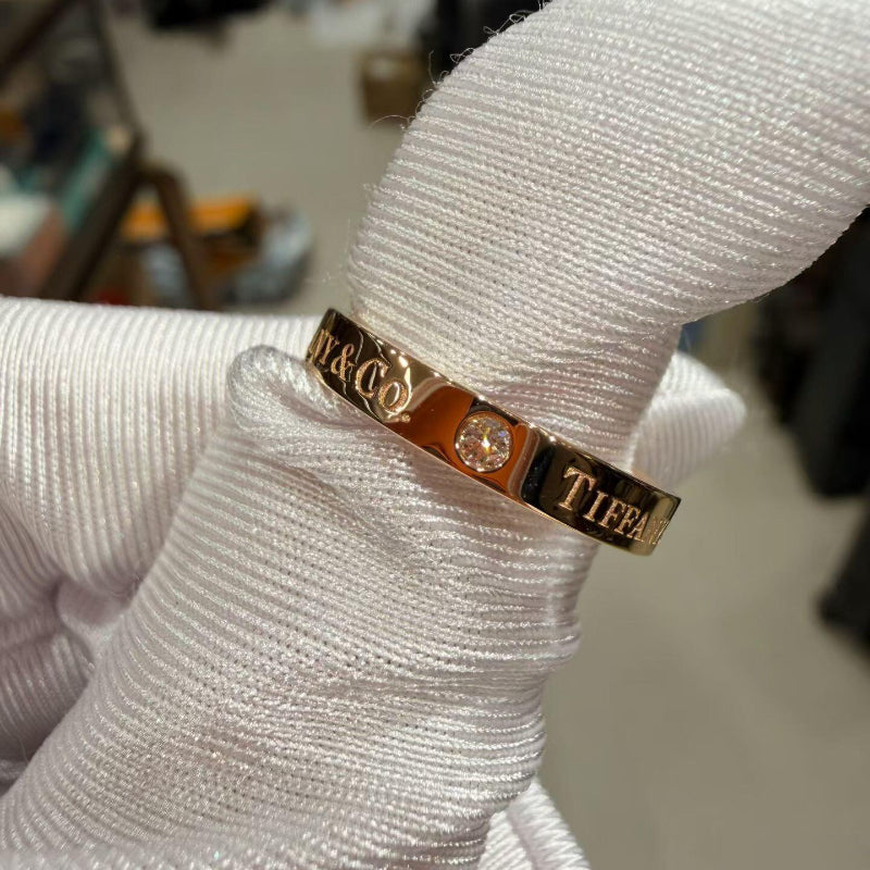 close up of channel set crystal pave on 3mm rose gold band ring