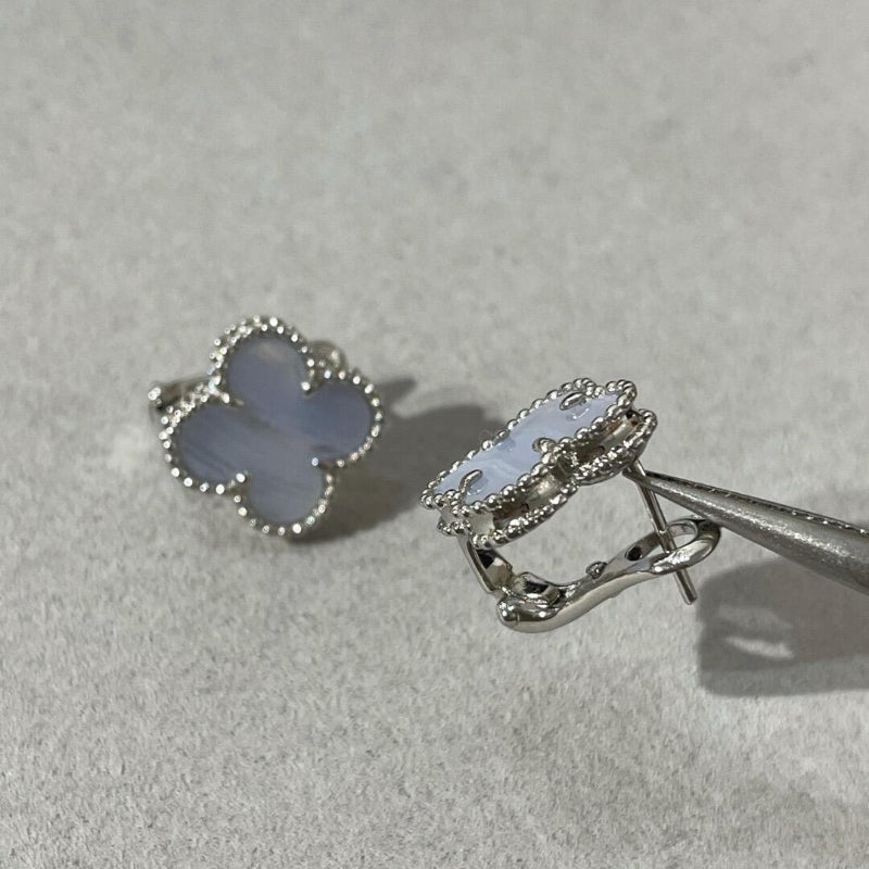 close up of soft blue chalcedony four leaf clover motif with gold bead contour on yellow gold earrings