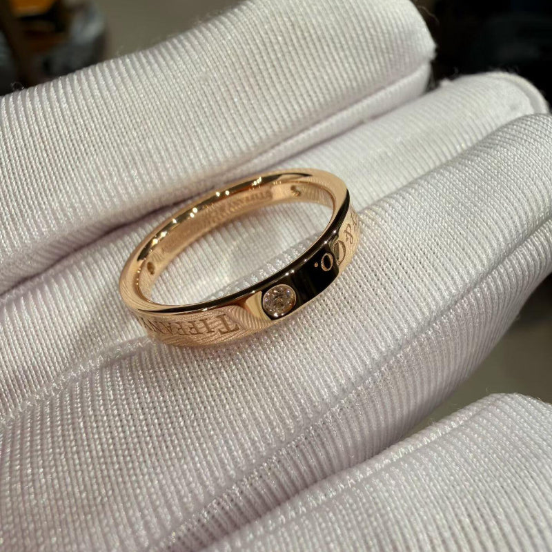 close up of channel set crystal pave on 3mm rose gold band ring