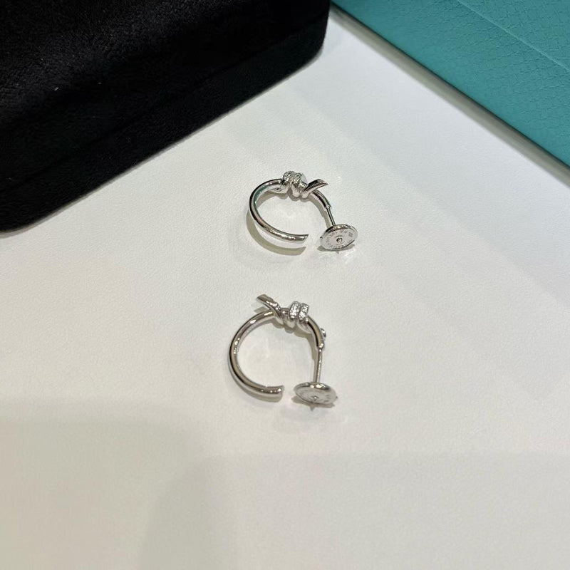 white gold knot style hoop earrings with crystal pave
