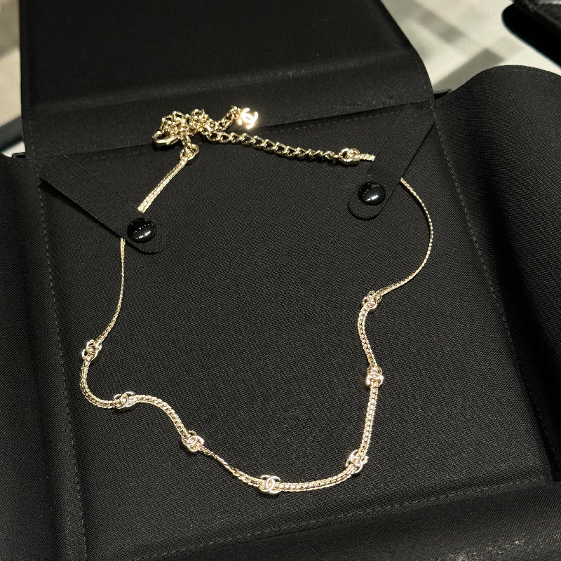 light gold 7 flower snake chain choker with CC logo links
