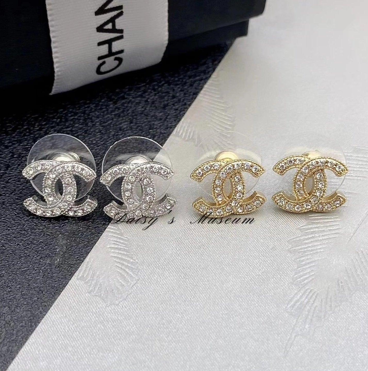 22 style CC classic crystal stud earrings on white background
