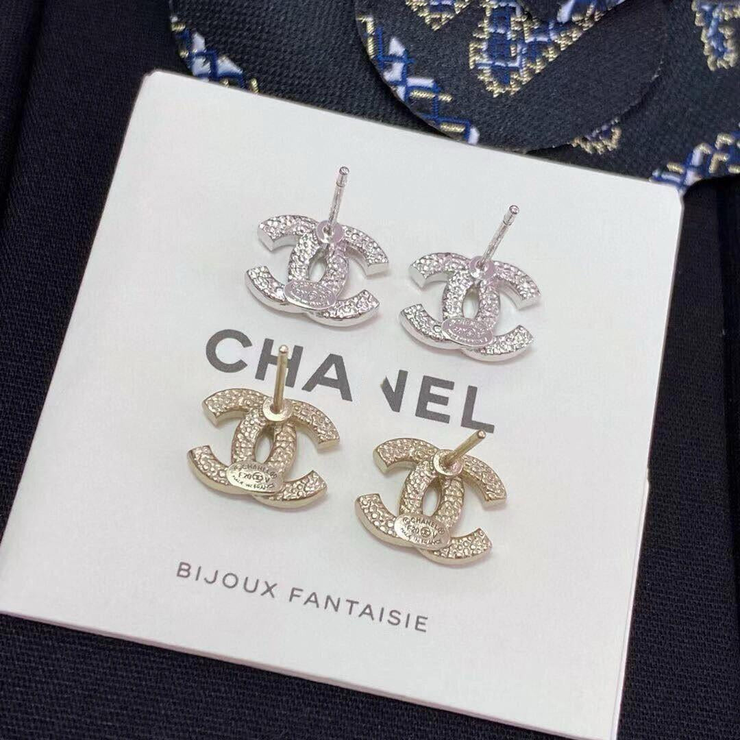 close up of crystal pave CC logo stud earrings 18K gold
