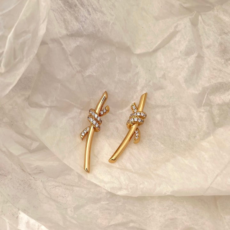 yellow gold knot style diamond pave earrings small motif