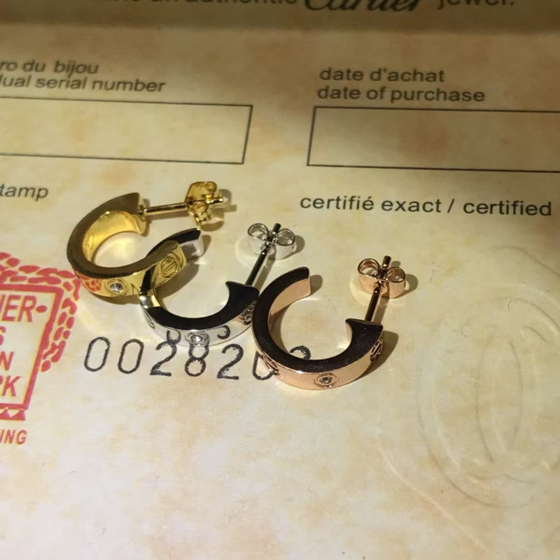 V gold 18K “love” earrings, with diamonds